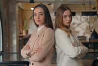 Two confident Caucasian business women girls partners