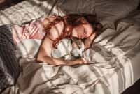 Young woman is lying and sleeping with