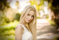 beautiful blond woman looking at camera outdoor