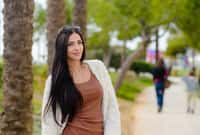 Portrait of beautiful smiling active woman walking