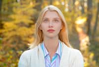 Portrait of woman walking outdoors in autumn