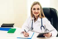 Female doctor and stethoscope working with computer