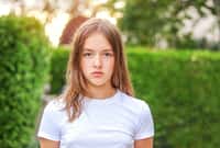 Close-up portrait of serious angry teenager girl