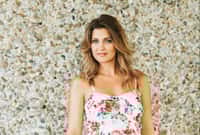 Outdoor portrait of beautiful woman wearing floral