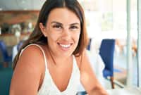 Close up of young beautiful woman sitting