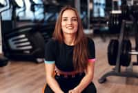 Woman fitness trainer portrait on a gym