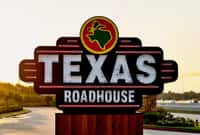 Texas Roadhouse restaurant sign by freeway company