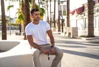 Handsome young man wearing white tshirt posing