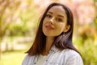 Portrait of beautiful young brunette woman looking