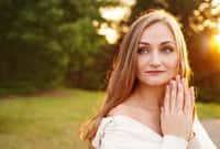 Beautiful calm girl outdoors. Summer woman portrait