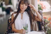 beautiful girl drinks mojito outside sunni weather