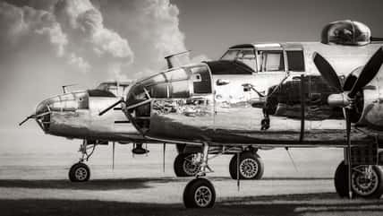 american bomber planes against a dramatic sky