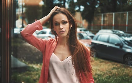 Casual pretty woman outdoors portrait. Beautiful brunette girl with long hair