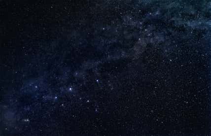 Constellation Cassiopeia with stellar band of our galaxy, the Milky Way, in the dark starry sky