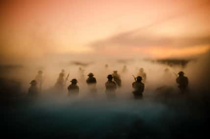 War Concept. Military silhouettes fighting scene on war fog sky background, World War Soldiers Silhouettes Below Cloudy Skyline At night. Attack scene. Armored vehicles. Tanks battle. Decoration