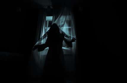 Horror woman in window