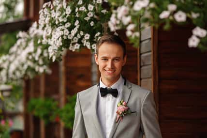 Wedding. Portrait of elegant groom with white teeth smile