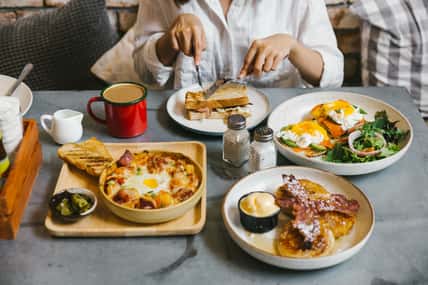Eggs Benedict, Crispy Bacon stuffed French toast, Cheesy Potato with Crispy Bacon and Pancakes with Maple Syrup, Bacon and Vanilla Ice Cream. Served with Hot Latte.