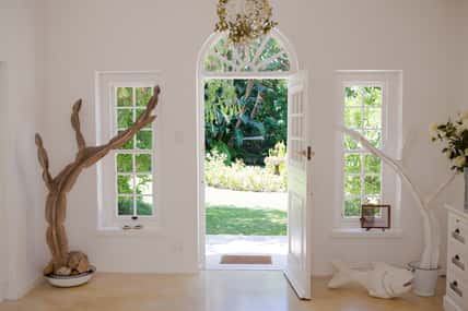 Open front door of modern house