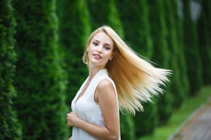 Portrait of adorable blonde woman outdoor, summer time