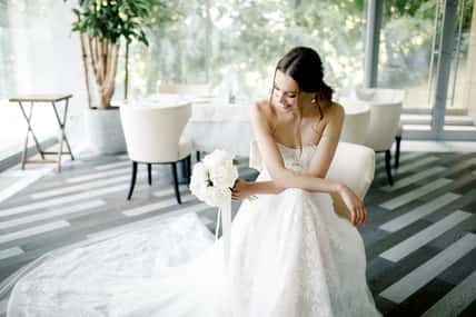 Beautiful bride wearing a fashion wedding dress in a beautiful restaurant