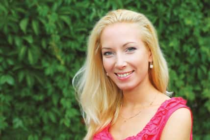 Portrait of young pretty blond woman outdoors
