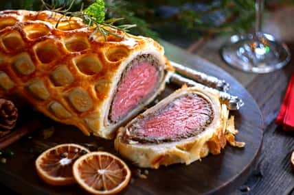 Beef Wellington - a fillet of beef tenderloin steak wrapped in puff pastry. Selective focus