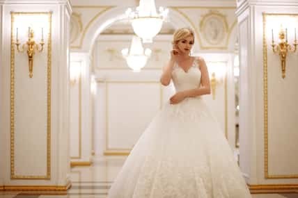 beautiful young woman bride in luxury wedding dress in interior