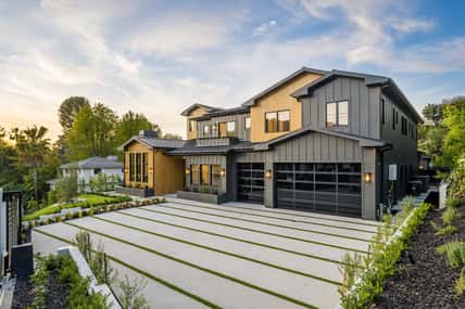 this is a picture of a nice modern style house with great landscaping