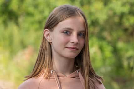 Portrait of a beautiful girl in nature, close up