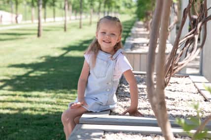 green park. Little girl smiles at the camera. girl is 5 years old. Krasnodar Park