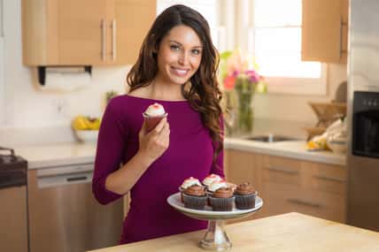 Young pretty housewife home chef baker amateur recipe cupcake dessert vegan low calorie