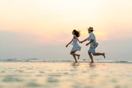 Happy Asian family couple walking and playing