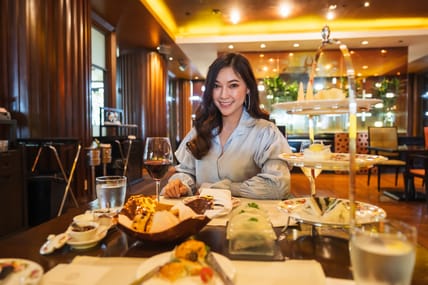 young beautiful woman eating in the restaurant