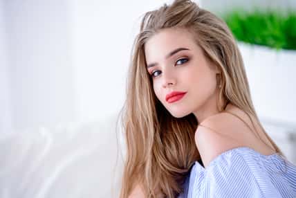 Portrait of a beautiful girl with long blonde hair. Beauty, cosmetics.