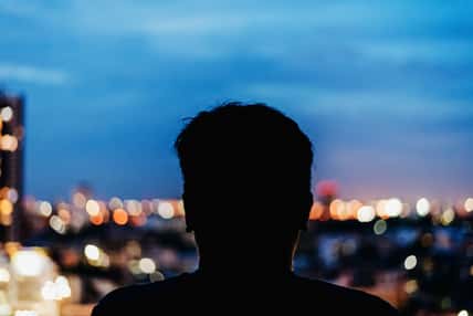 Man watching the view from skyscraper. Contours
