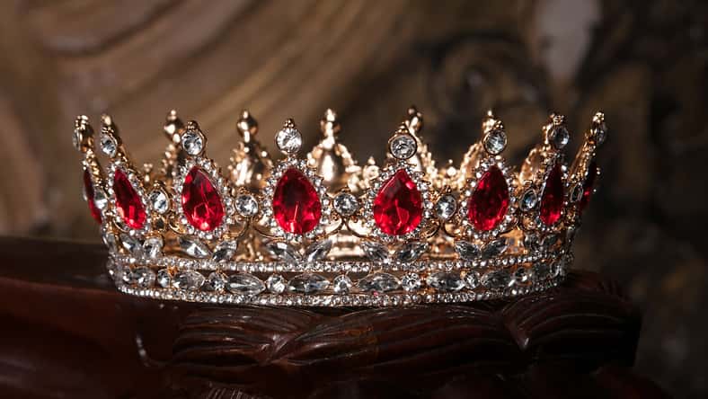 Royal crown with red gems. Ruby, garnet. Symbol of power and authority