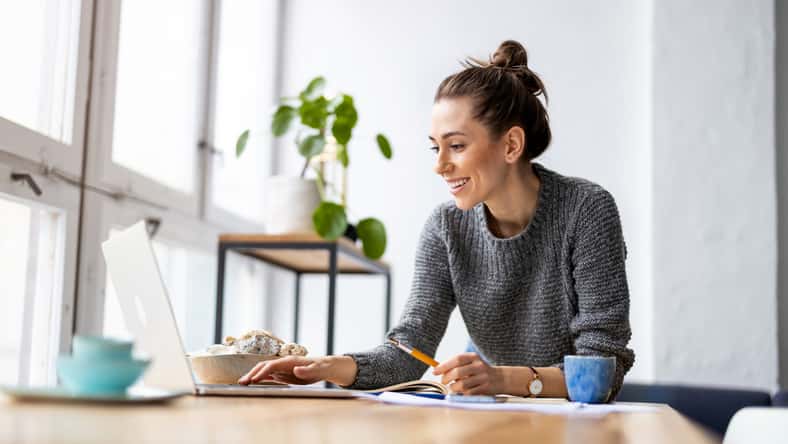 woman sitting at her desk doing work on the computer