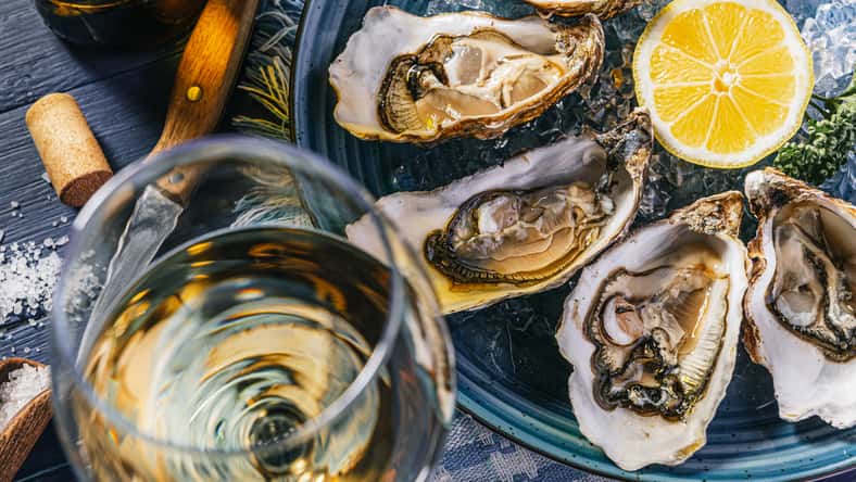 Fresh oysters with lemon ice and white wine.