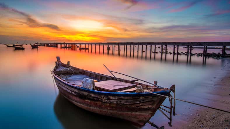 sunset on the sea with a boat