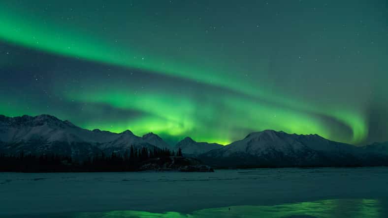 Aurora sky in Alaska with strong Northern Lights