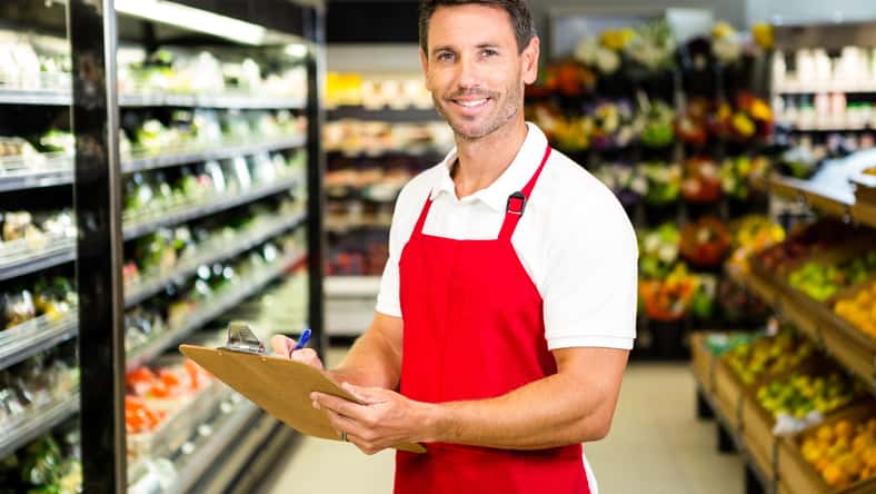 Smiling worker with clipboard