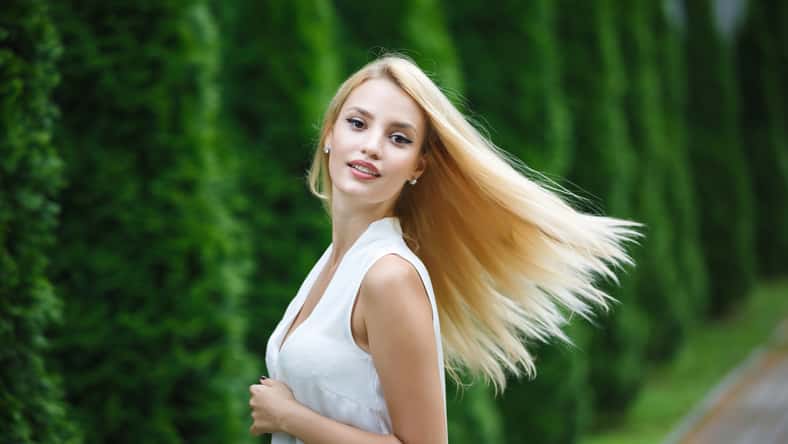 Portrait of adorable blonde woman outdoor, summer time