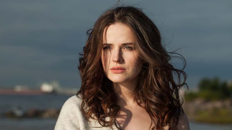Close-up portrait of brunette woman 30 s years old resting outdoors