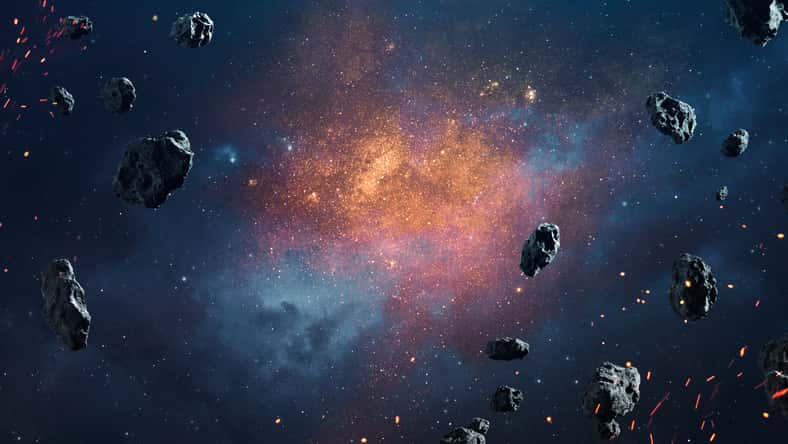 Abstract cosmic background with asteroids and glowing stars. Deep space image, science fiction fantasy in high resolution ideal for wallpaper and print. Elements of this image furnished by NASA