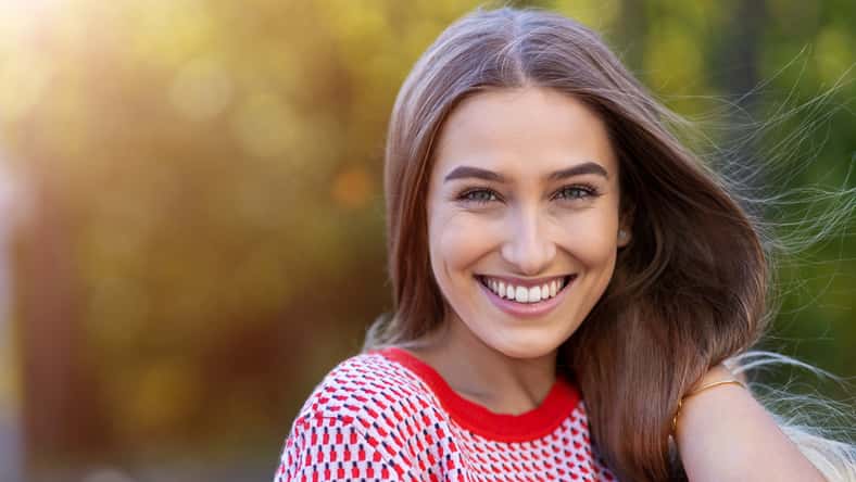 Portrait of beautiful young woman outdoors