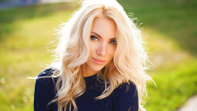 Portrait close up of young beautiful blonde woman, summer outdoors