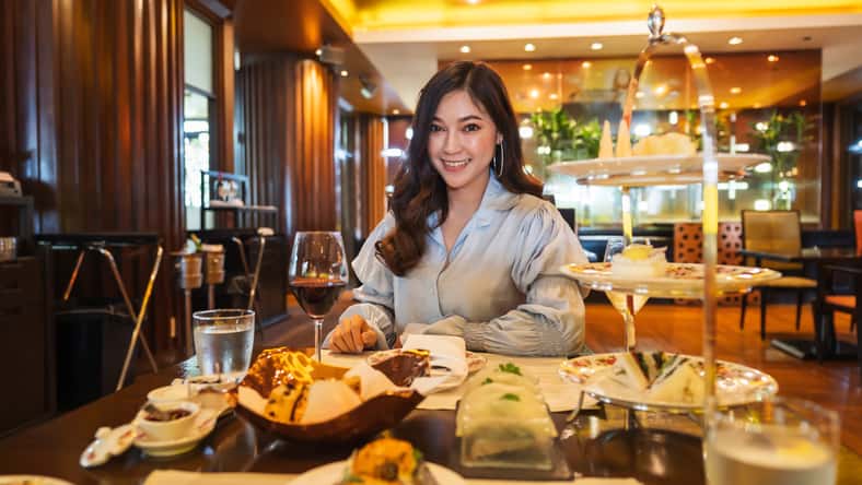 young beautiful woman eating in the restaurant