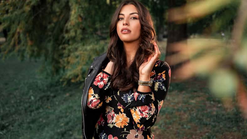 Fall fashiom and beauty portrait, attractive feminine brunette in dress and with leather jacket