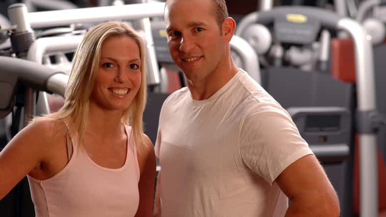 happy fitness couple in the gym